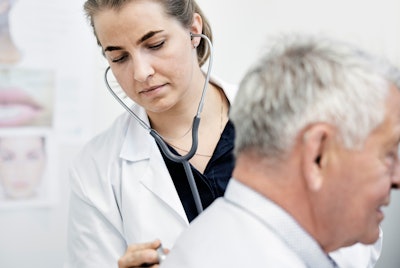Photo of doctor examining a patient's breathing with a stethoscope