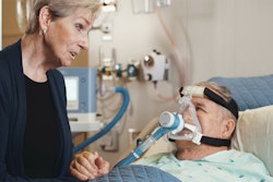 Patient using breathing device with ReddyPort elbow.