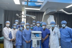 Team of doctors posing around a COPD treatment machine