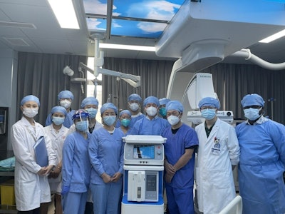 Team of doctors posing around a COPD treatment machine