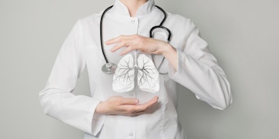 Photo of doctor with hands surrounding graphic of lungs.