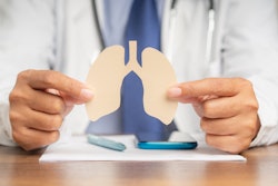 Picture of doctor holding paper cutout of lungs