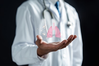 Photo of doctor with hand outstretched and graphic of lungs in his palm.