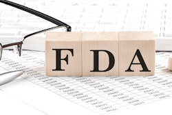 Photo of blocks with FDA on them sitting on top of papers.