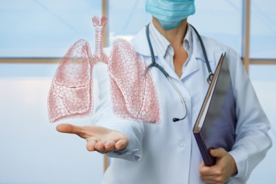 Graphic of doctor showing human lungs in hand.