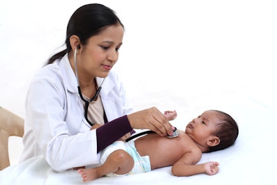 This is a photo of a female physician is caring for an Asian baby.