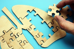 Puzzle pieces forming a pair of lungs to represent lung treatment.
