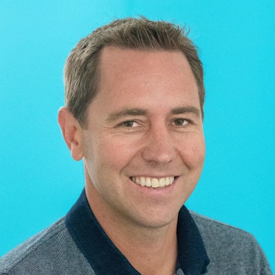 This is a professional headshot of the lead researcher in the story, Benjamin Marsland, PhD.