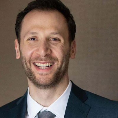 Head shot of Adam Schoenfeld