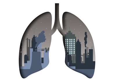 Illustration of lungs with a cityscape and air pollution inside.