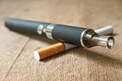 This is a photo of a vape pen and cigarette.