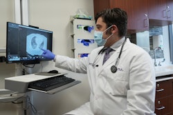 Dr. Sala reviewing lung scans.