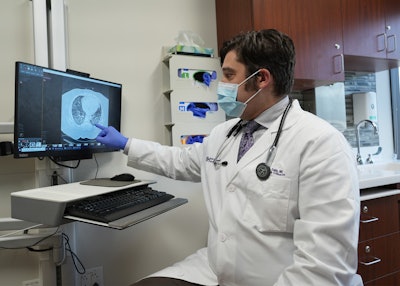 Dr. Sala reviewing lung scans.