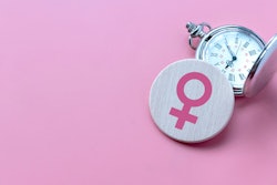 This is an image of a female symbol and a stop watch to signify menopause.