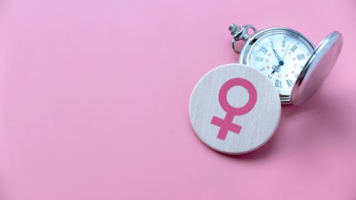 This is an image of a female symbol and a stop watch to signify menopause.