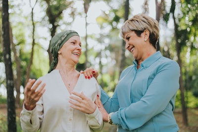 Cancer survivor and friend outside