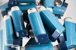 This is a photo of a pile of asthma inhalers.