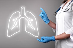 Image of female doctor holding up gloved hands to a neon outline of lungs.