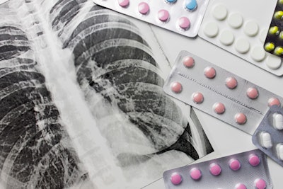 Fluorograpy, x-ray and different pills in blisters on white background