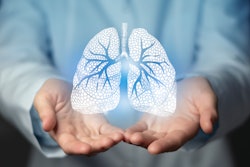 This is an image of two, male hands holding computer generated lungs in his hands.