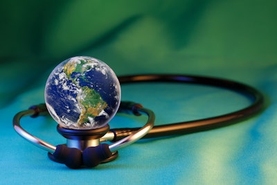Image of earth surrounded by a stethoscope.