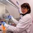 Claudia Loebel, MD, PhD, preparing samples in the lab.