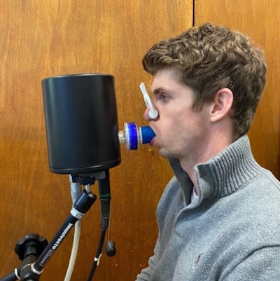 A volunteer undertaking a computed cardiopulmonography based breath test.