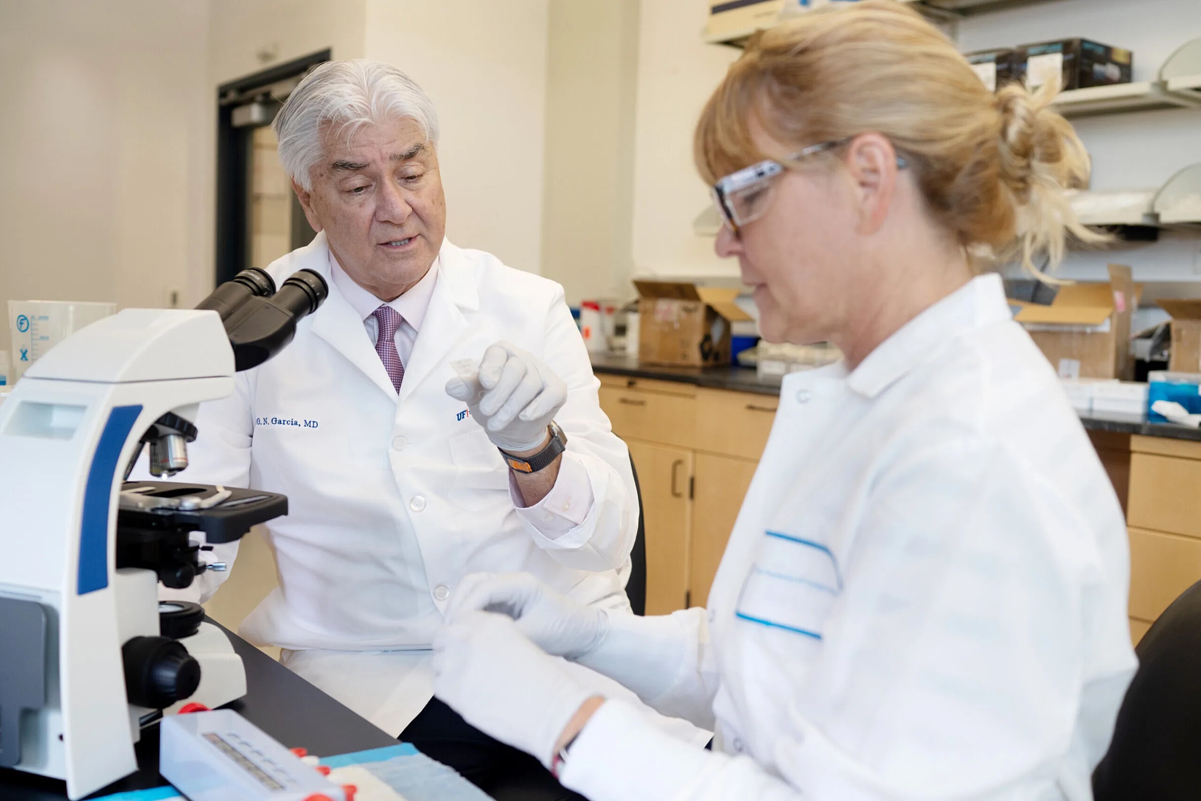 Joe G. N. Garcia, MD, associate vice president for research at UF Health, and Susannah Patarroyo-White, a senior staff scientist, work in the lab.