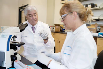 Joe G. N. Garcia, MD, associate vice president for research at UF Health, and Susannah Patarroyo-White, a senior staff scientist, work in the lab.