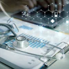 Healthcare professional workspace with stethoscope, medical charts, smartphone, and digital health technology icons